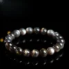 Flat lay of Auracharming Black Sunstone Skeleton Bracelet