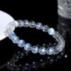 Overhead view of Auracharming Moonstone Bracelet in a seashell bowl