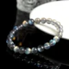 Overhead view of Auracharming Gray Moonstone Bracelet in a crystal bowl