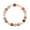 Overhead view of Auracharming Moonstone Bracelet in a marble bowl