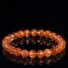 Auracharming Red Copper Rutile Bracelet Flat Lay