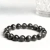 Flat lay of Auracharming Silver Flash Sunstone Bracelet
