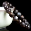 Overhead view of Auracharming Skeleton Bracelet in a geode bowl