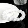 Auracharming White Phantom Bracelet Close-Up, Zoom on Money Bowl Bead with Volcanic Clay Layers