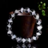 Auracharming White Phantom Bracelet on Polished Wood Tray Highlighting Pyramid Inclusions