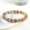 Auracharming Natural Black Gold Super Seven Bracelet on White Tray – Top View