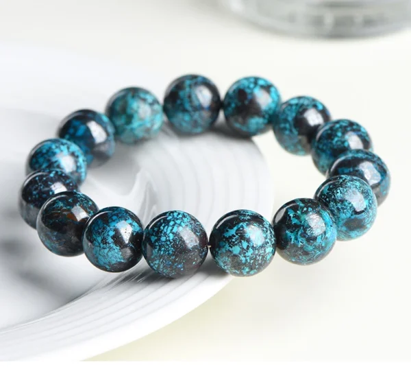 Auracharming Natural Chrysocolla Malachite stones displayed in a white ceramic bowl.