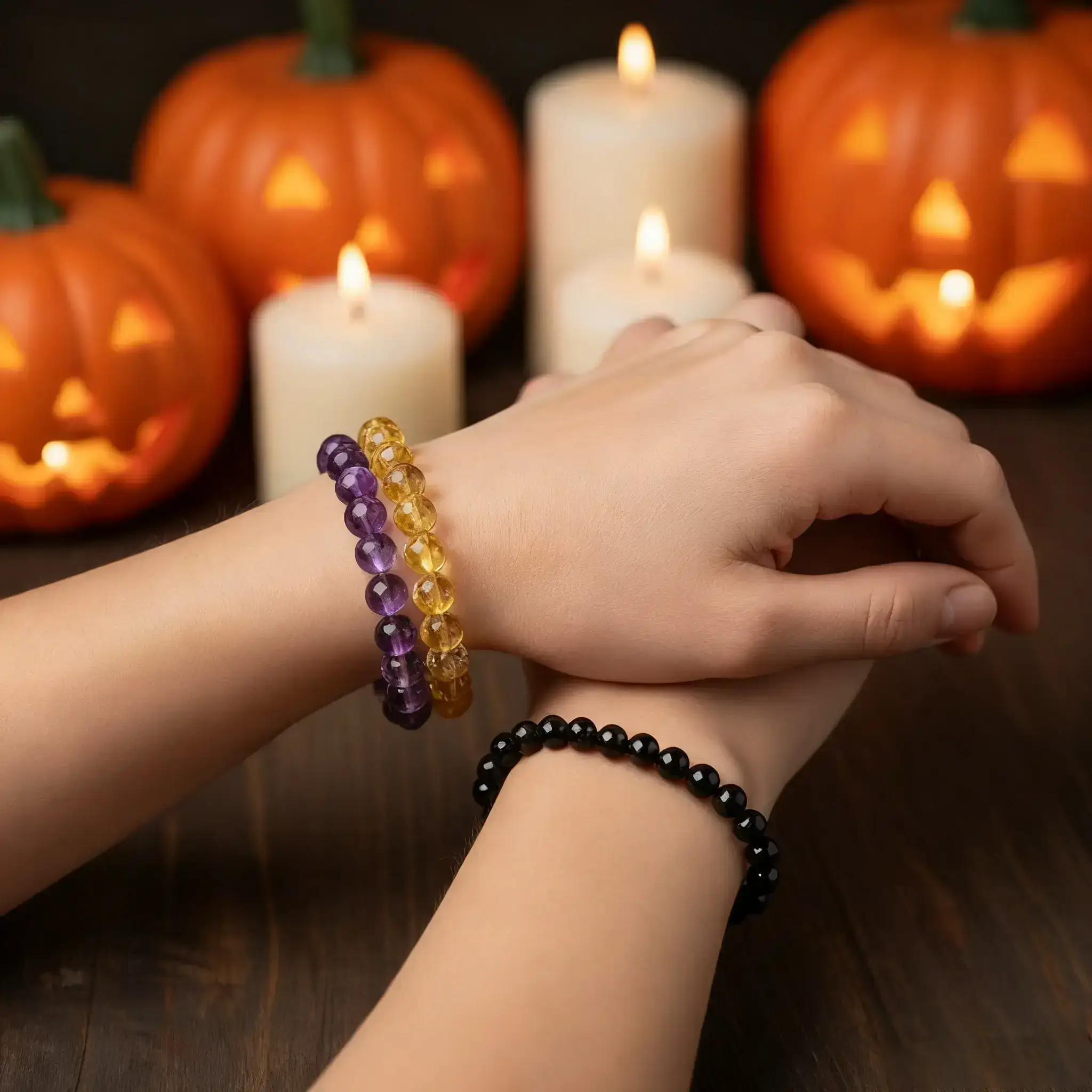 Fashionable display of multiple crystal bracelets stacked on woman's wrist