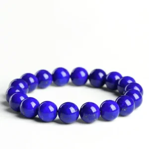 Auracharming Natural Lapis Lazuli Bracelet flat lay, showing deep blue beads with golden Pyrite flecks.